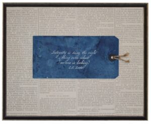 Navy tag with C.S. Lewis Integrity quote on newsprint