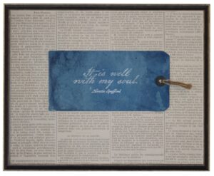 Navy tag with it is well with my soul quote on newsprint