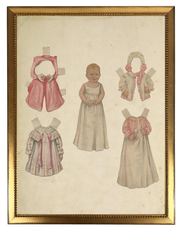 Vintage baby girl paperdoll with clothes on a distressed background