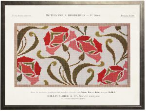 Vintage bookplate of fabric embroidery on a natural background